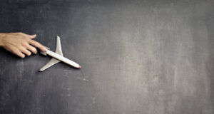 A depiction of an aeroplane flying on a chalkboard.