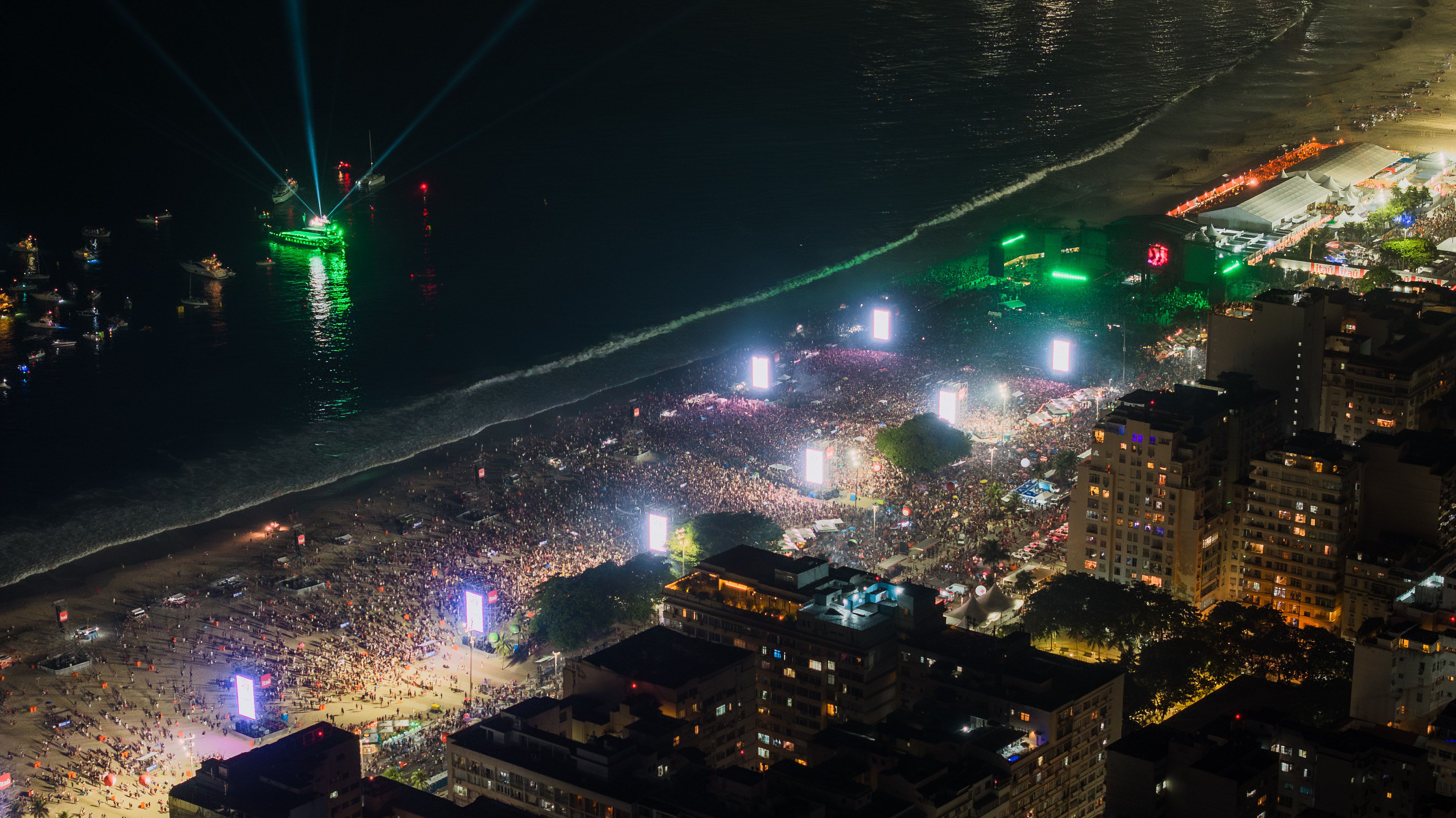 Aerial view of crowds celebrating New Year's Eve on Copacabana Beach in Rio de Janeiro